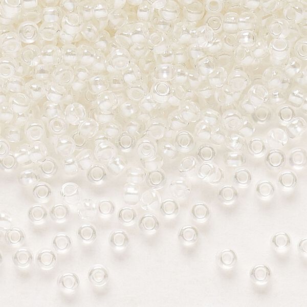 Seed bead, Preciosa Ornela Czech glass, pkg/500g, #11 rocaille, translucent color-lined luster pastel ivory, (382PI). image number 0