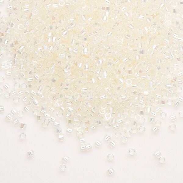 Seed bead, Delica®, glass, pkg/250g, #11 round, translucent rainbow glazed luster crystal ivory (DB-0109). image number 0