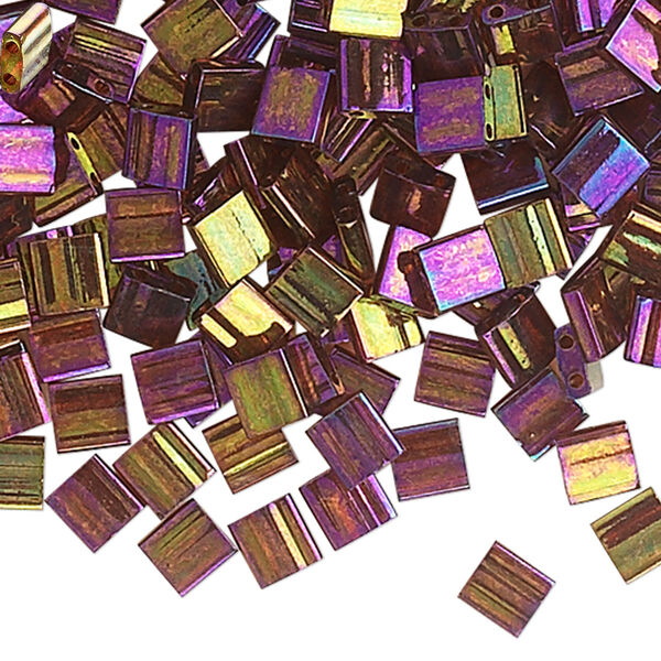 Seed bead, TILA®, glass, pkg/10g, 5mm full tila square, translucent rainbow gold luster dark topaz, (TL-301). image number 0