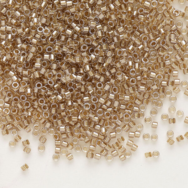 Seed bead, Delica®, glass, pkg/7.5g, #11 round, translucent beige-lined luster crystal clear (DB-0907). image number 0