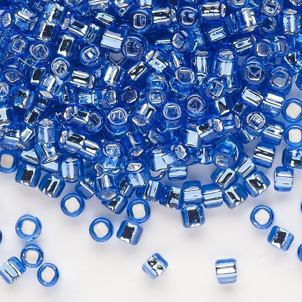 Seed bead, Dyna-Mites™, glass, silver-lined translucent blue, #6 round with square hole. Sold per 40-gram pkg. image number 0