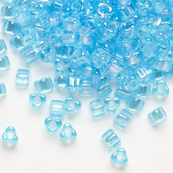 Seed bead, Miyuki, glass, transparent iris light blue, (TR1155), #5 triangle. Sold per 250-gram pkg. image number 0