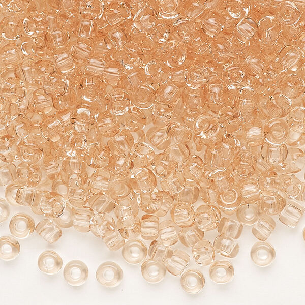 Seed bead, Dyna-Mites™, glass, transparent light peach, #6 round. Sold per 1/2 kilogram pkg. image number 0