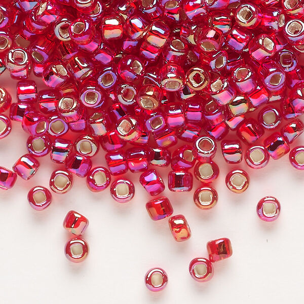 Seed bead, Dyna-Mites™, glass, silver-lined translucent rainbow ruby red, #6 round with square hole. Sold per 1/2 kilogram pkg. image number 0