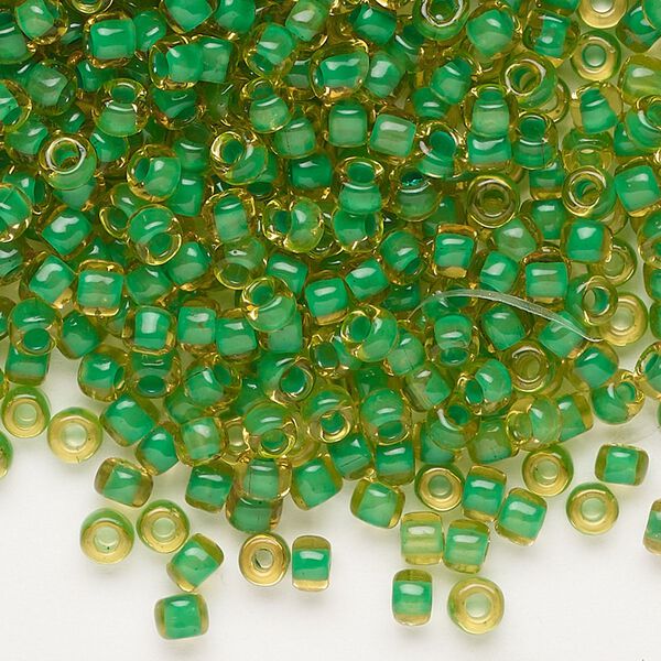 Seed bead, Dyna-Mites™, glass, translucent inside color lime, #6 round. Sold per 1/2 kilogram pkg. image number 0
