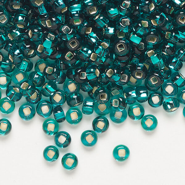 Seed bead, Preciosa Ornela Czech glass, pkg/50g, #6 rocaille, transparent silver-lined teal, (57710). image number 0