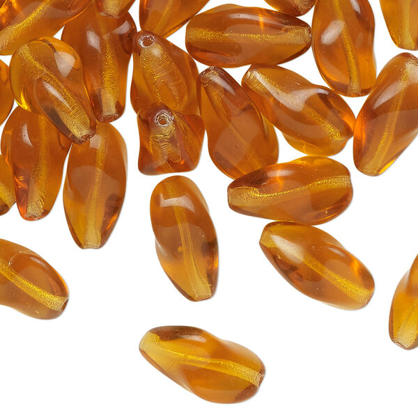 Bead, pressed glass, translucent golden honey, 14x9mm twisted freeform. Sold per 1-ounce pkg, approximately 35 beads. image number 0