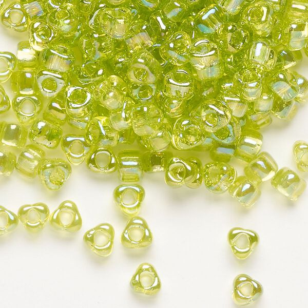 Seed bead, Miyuki, glass, transparent iris lime, (TR1153), #5 triangle. Sold per 25-gram pkg. image number 0