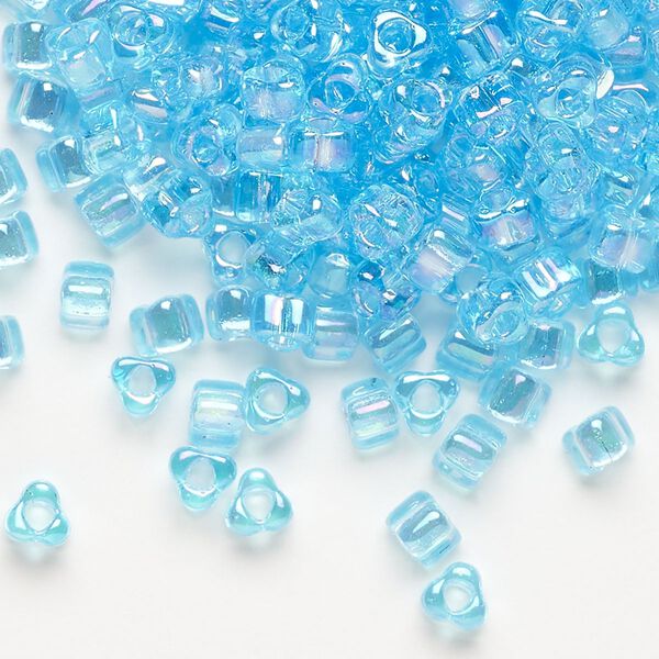 Seed bead, Miyuki, glass, transparent iris light blue, (TR1155), #5 triangle. Sold per 250-gram pkg. image number 0