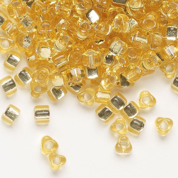 Seed bead, Miyuki, glass, silver-lined translucent amber yellow, (TR1102), #5 triangle. Sold per 25-gram pkg. image number 0