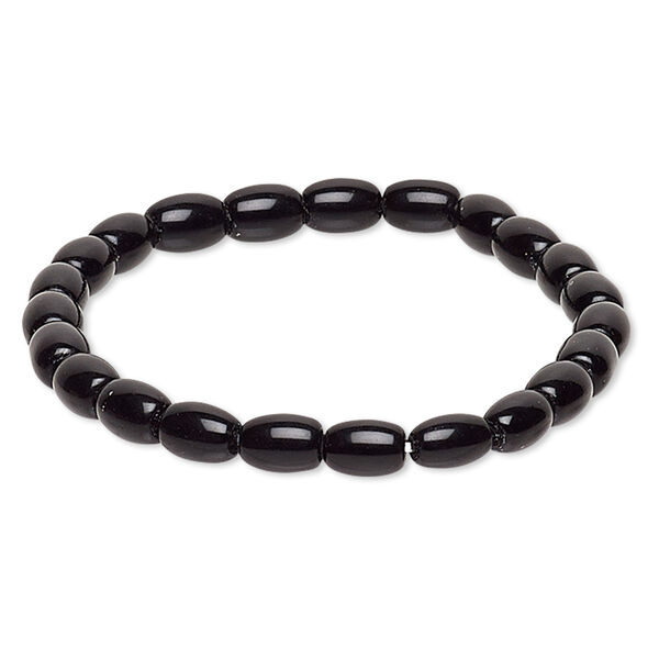 Bracelet, stretch, glass, black, 7x5mm-8x6mm barrel, 6-1/2 inches. Sold individually. image number 0