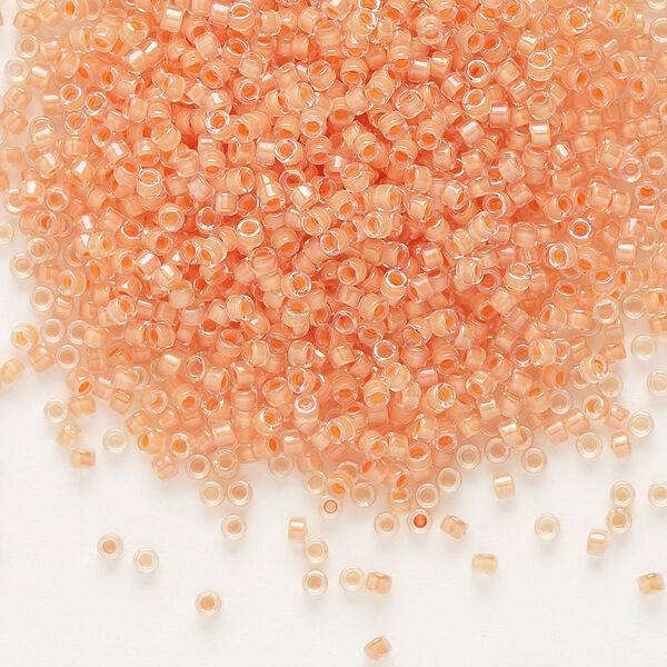 Seed bead, Delica®, glass, pkg/7.5g, #11 round, translucent peach-lined luster crystal clear (DB-0068). image number 0