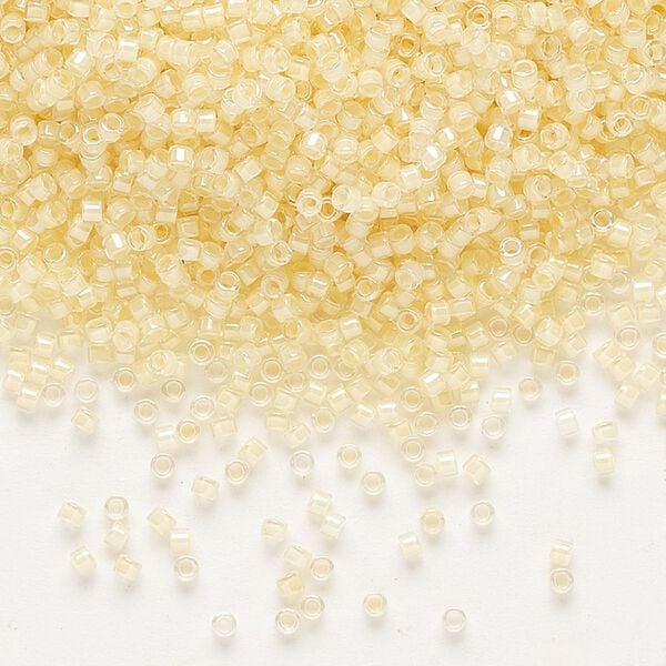 Seed bead, Delica®, glass, pkg/50g, #11 round, translucent ivory-lined luster crystal clear (DB-2371). image number 0