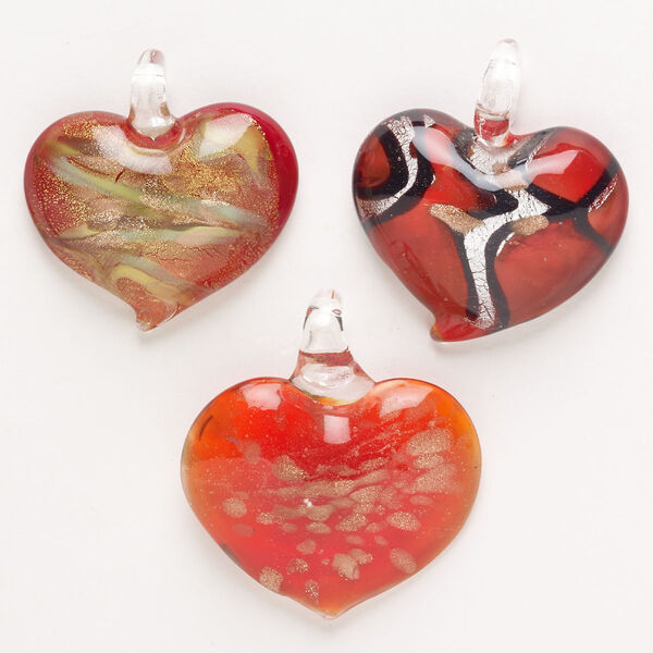 Random focal mix, lampworked glass, pkg/3, opaque and translucent mixed colors with silver-colored foil and copper-colored glitter, 34x32mm-40x35mm puffed heart. image number 0