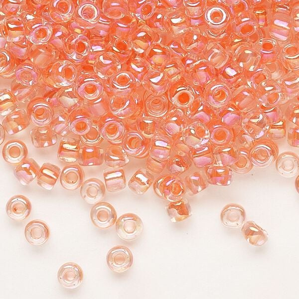 Seed bead, Dyna-Mites™, glass, transparent rainbow inside color peach, #6 round. Sold per 40-gram pkg. image number 0