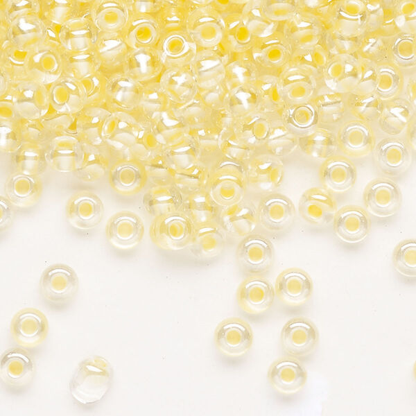 Seed bead, Preciosa Ornela Czech glass, pkg/500g, #6 rocaille, translucent color-lined luster pastel yellow, (382PY). image number 0