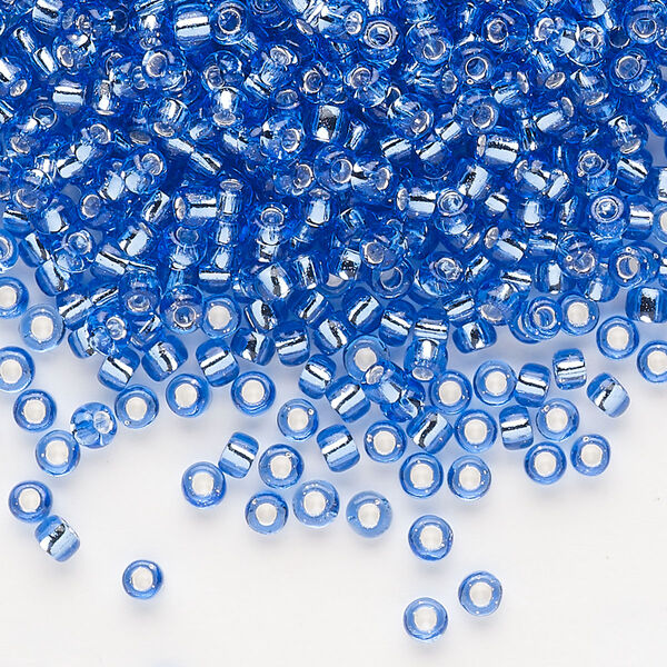 Seed bead, Dyna-Mites™, glass, silver-lined translucent blue, #8 round. Sold per 40-gram pkg. image number 0