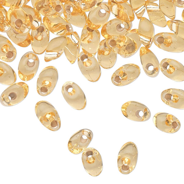 Seed bead, Miyuki, glass, pkg/50g, 7x4mm long magatama, transparent silver-lined light gold (LMA-3). image number 0