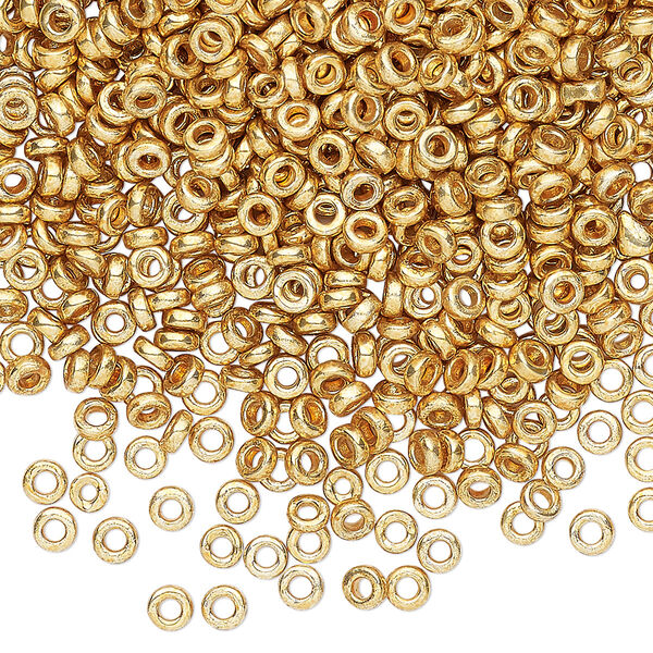 Seed bead, Miyuki, glass, pkg/50g, 3x1.3mm spacer rondelle, opaque gold finish, (SPR3-4202). image number 0