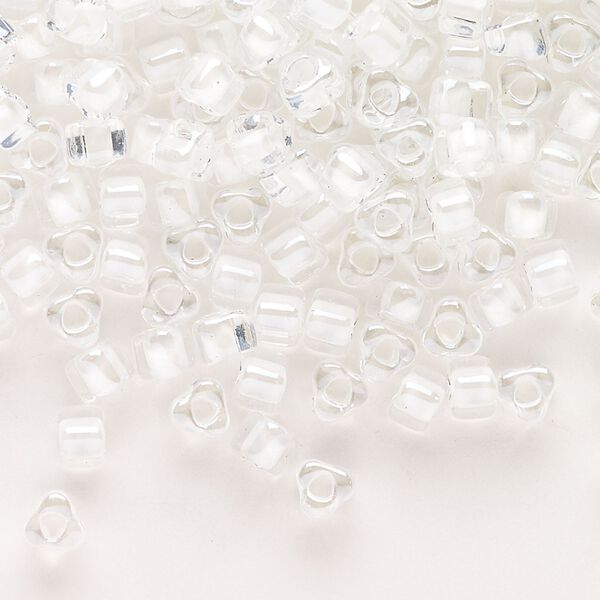 Seed bead, Miyuki, glass, transparent clear color-lined white, (TR1104), #5 triangle. Sold per 25-gram pkg. image number 0