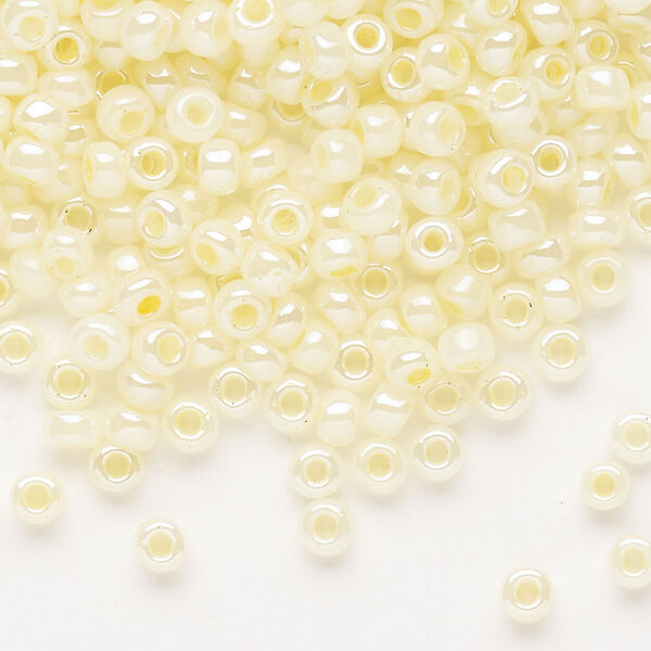 Seed bead, Dyna-Mites™, glass, opaque ceylon pastel cream, #6 round. Sold per 1/2 kilogram pkg. image number 0