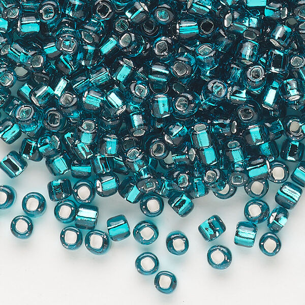 Seed bead, Dyna-Mites™, glass, silver-lined translucent teal blue, #6 round with square hole. Sold per 1/2 kilogram pkg. image number 0