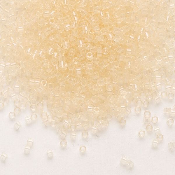 Seed bead, Delica®, glass, pkg/7.5g, #11 round, transparent pale beige glass enamel crystal clear (DB-1409). image number 0
