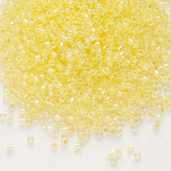 Seed bead, Delica®, glass, pkg/50g, #11 round, translucent light yellow-lined rainbow crystal clear (DB-0053). image number 0
