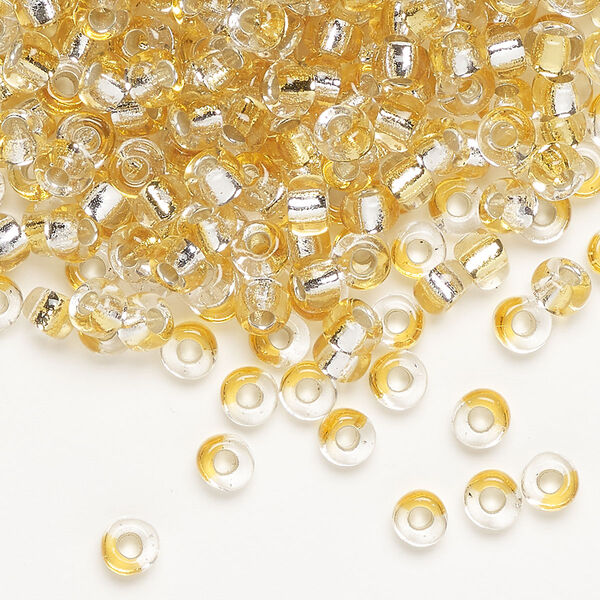 Seed bead, Miyuki, glass, pkg/250g, 4mm irregular round, transparent silver-lined light gold/clear, (TB-3931). image number 0