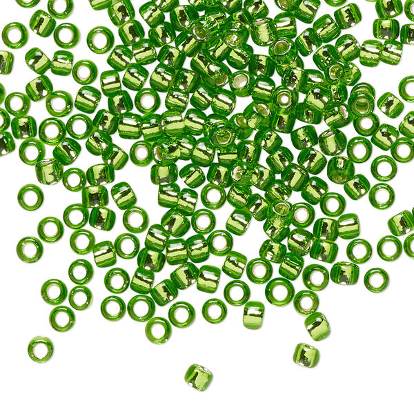 Seed bead, TOHO BEADS®, glass, pkg/250g, #8 round, transparent silver-lined peridot (TR-08-27). image number 0