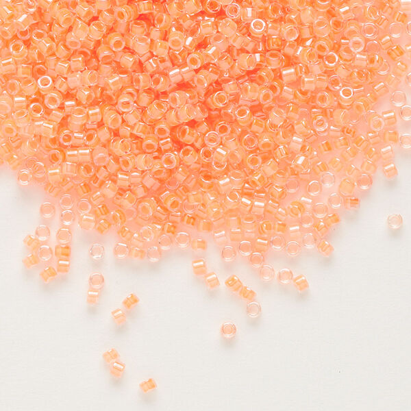 Seed bead, Delica®, glass, pkg/7.5g, #11 round, translucent luminous inside dyed color creamsicle (DB-2033). image number 0