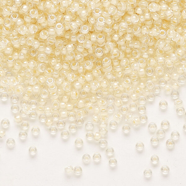 Seed bead, Miyuki, glass, pkg/250g, #11 rocaille, translucent ivory-lined luster crystal clear (RR-2215). image number 0