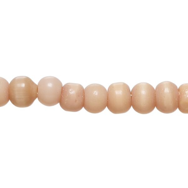 Bead, cat's eye glass (fiber optic glass), peach, 6-8mm irregular round. Sold per 14-inch strand, approximately 70 beads. image number 0