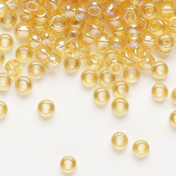 Seed bead, Miyuki, glass, pkg/25g, #6 rocaille, translucent rainbow light topaz (RR-251). image number 0