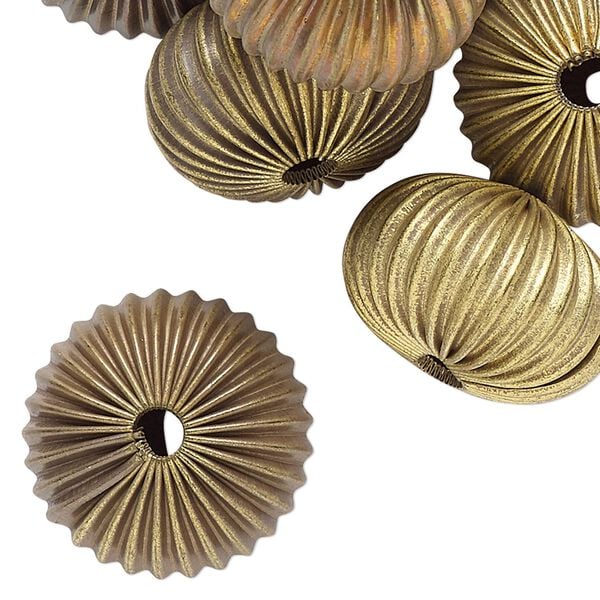 Bead, raw brass, 21x13mm- 22x14mm corrugated rondelle with 3.5mm hole. Sold per pkg of 24. image number 0