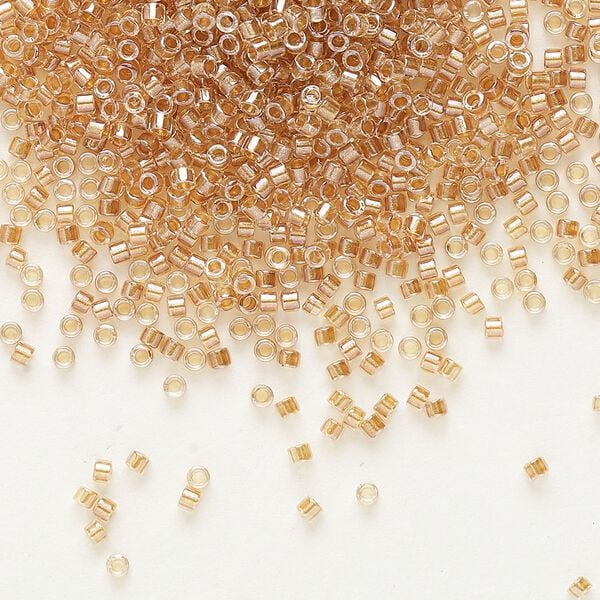 Seed bead, Delica®, glass, pkg/7.5g, #11 round, translucent honey beige-lined luster crystal clear (DB-0901). image number 0